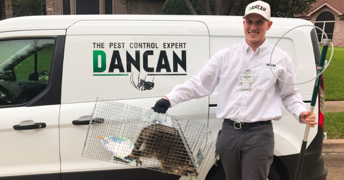 DANCAN Pest Control professional taking out the trash (panda)